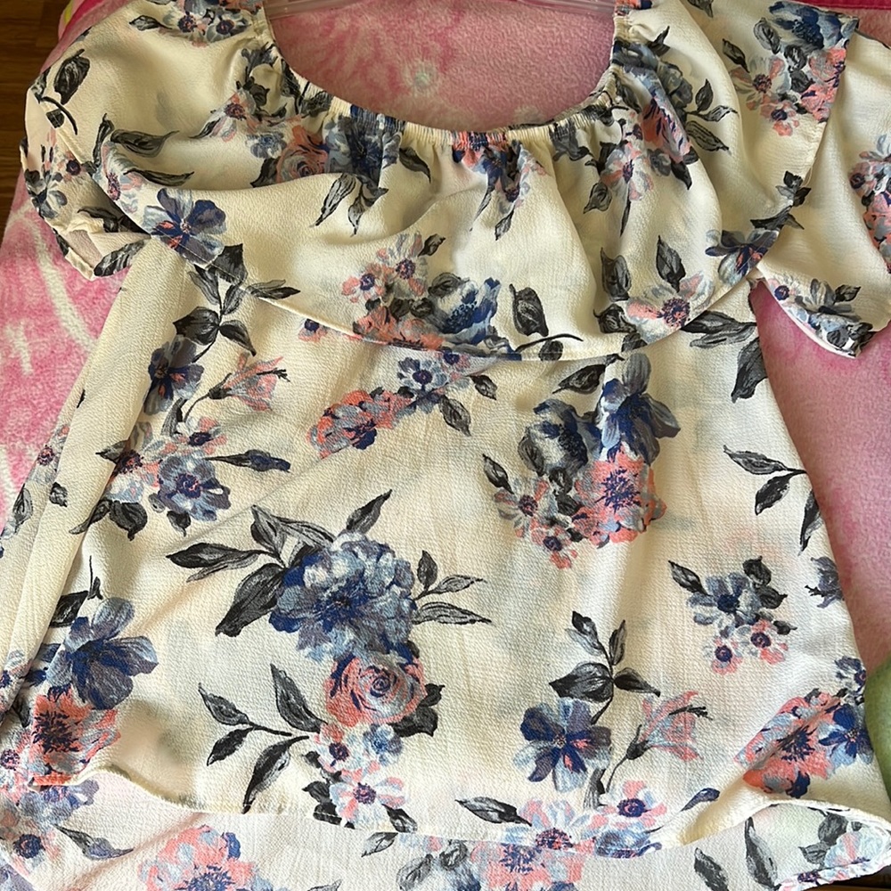 A floral shirt that’s a size medium.